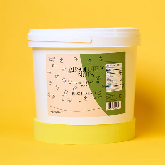 Bucket of 'Absolutely Nuts' pistachio paste on a yellow background